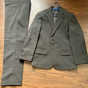 Black suit with white stripes brand new. Size 10 Boys.